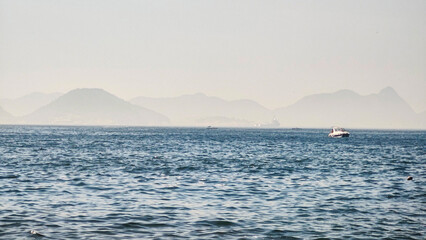 Wall Mural - Sugarloaf Mountain Boat Rio de Janeiro approximate detail fishing health cable cars dawn landscape travel life nature beauty oil tanker sea horizon islands vegetation sun