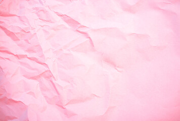 Crumpled pink background paper sheet texture. Pale pink craft background.Old textured paper copy space.