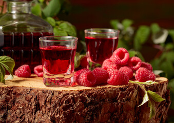 Wall Mural - Raspberry liquor and fresh berries.