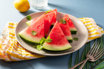 Wall Mural - Fresh slices of red watermelon in a plate. Summer fruits