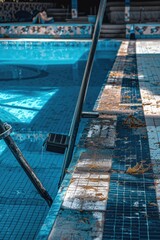 Wall Mural - A pool with a ladder standing out against the surrounding area