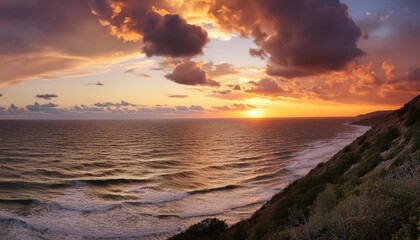Wall Mural - dramatic sky over the sea at sunset