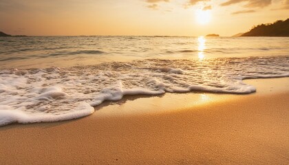 sandy beach and sea wave in warm sunset light tropical shore background with copy space