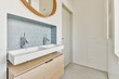 © ADDICTIVE STOCK - Modern bathroom with double sink and hexagonal tiles