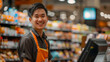 © Michael - Cheerful young cashier with a friendly smile at the grocery store checkout