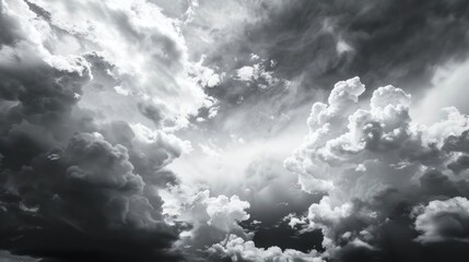 Wall Mural - Abstract background of beautiful black sky with white natural clouds and monochrome storm clouds