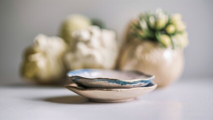 Sticker - A close up of two small bowls sitting on a table, AI