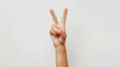 © Marco - hand of a woman making the peace sign on white background