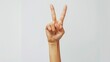 © Marco - hand of a woman making the peace sign on white background