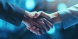© vefimov - Two professionals shaking hands, marking the start of a new business partnership