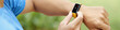 © DragonImages - A close-up shot of a smartwatch displaying heart rate monitor during an outdoor exercise session