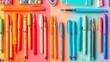 © Thavesak - A creative flat lay of ballpoint pens and art supplies arranged in a rainbow pattern, illustrating the colorful and diverse possibilities in artistic expression and stationery