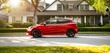 © Usman - Red compact hatchback half side view with copy space on suburban background for small car ads