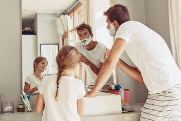 Wall Mural - Mirror, kid and dad with shaving in bathroom for hygiene, cleaning and morning routine at home. Happy, family and man with girl on fathers day for skincare support, child development and bonding