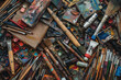 © tiena - Flat lay with a used artistic tools - paintbrushes, palette knives, tubes of paint . AI generative