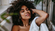 © Alina Tymofieieva - Beautiful portrait of a black African woman doing self care. She enjoys alone time very well