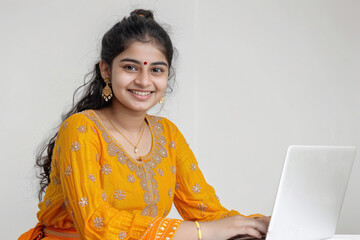 Wall Mural - young indian female student using laptop
