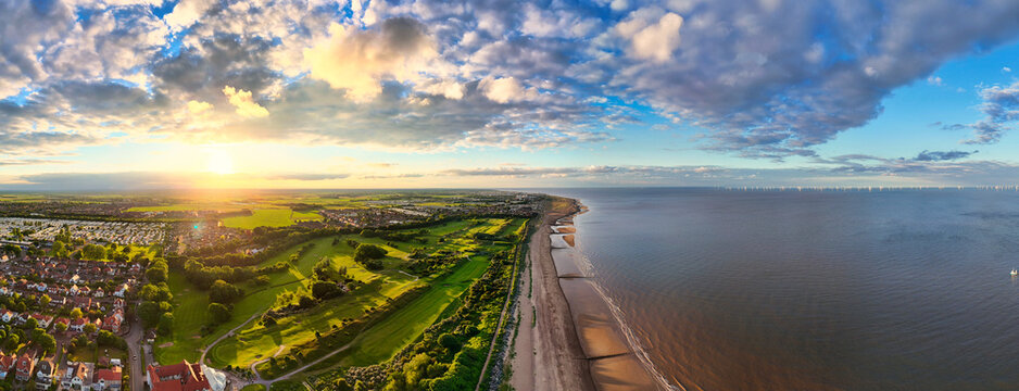 Sunset Aerial Panoramic View of the UK Seaside Skegness, a busy tourist town with something for everyone, from stunning campsites to a sunset to die for, showcases the beauty of a serene sunset