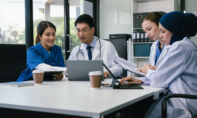 Wall Mural - diversity, medical team working on digital tablet healthcare doctor technology tablet using computer