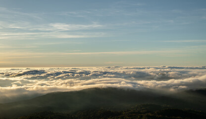 Wall Mural - panoramic of foggy at morning, mountains top view of sunrise landscape in the rainforest, thailand.