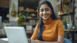 © Niks Ads - young happy indian woman using laptop at home