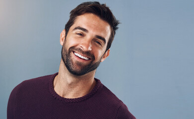 Wall Mural - Happy, man and portrait with mockup for confidence, pride and positive attitude isolated in studio. Smile, male person or model with commercial space for pride and optimism with gray background