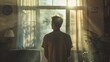 © Adobe Contributor - man looking out the window