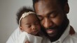 © seelya - Tender Moment Between African American Father and Newborn Daughter