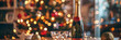 © Lidok_L - A bottle of champagne is on a table next to a Christmas tree