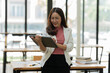 © Thitisak - Asian business woman working with tablet.