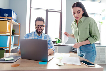 Canvas Print - Photo of happy busy coworkers wear shirts communicating modern device indoors workplace workstation