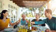 © peopleimages.com - Food, love and happy family with champagne toast on patio for event, party or birthday celebration. Wine, cheers and group of people in backyard for brunch, bonding or care, support and lunch reunion