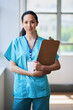 © Meeko Media - Confident Female Nurse Holding Clipboard in Hospital Setting