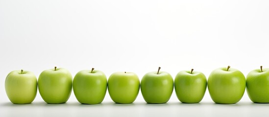 Poster - Green apples displayed against a white backdrop with copy space image.
