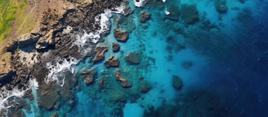 Wall Mural - Aerial view of the ocean showing reefs, road, and coastline with plenty of copy space image available.