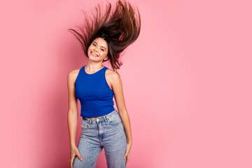 Poster - Photo of adorable lovely girl wear tank top flying hair empty space isolated pink color background