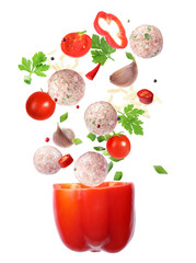 Wall Mural - Stuffed pepper recipe. Fresh ingredients falling into bell pepper on white background