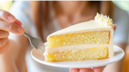 Wall Mural - A close up of the mouth of a female taking a bite of a  shaped sponge cake, natural look, 