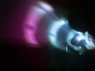 Wall Mural - light reflections in dark pink and blue for a magical abstract background.