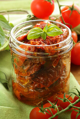 Wall Mural - traditional Italian sun-dried tomatoes in oil with basil