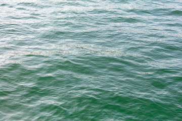 Wall Mural - Turquoise water in the sea as an abstract background. Texture