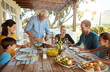 © GR/peopleimages.com - Grandparents, parents and kids with food for lunch, supper and eating meal together for Christmas. Celebration, family and children for bonding, relax and talking for nutrition, health and wellness