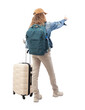© amedeoemaja - Rear view of a young woman tourist traveling with a backpack and a trolley suitcase, pointing finger forward. Isolated on a white background. Concept of vacation, choice, or online booking