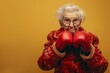© Michael - Old senior lady in boxing gloves fights