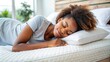 © Sangpan - Young African American woman sleeping peacefully in a comfortable bed on an orthopedic mattress at home , rest, relaxation, healthy sleep, bedroom, calm, serene, restful, peaceful, comfort