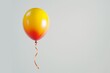 © Enigma - Single gradient balloon with an orange and yellow color scheme, featuring a curly red ribbon, floats in a serene space against a clean, neutral white background providing a minimalist aesthetic
