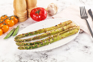 Canvas Print - Grilled asparagus sprouts served red pepper