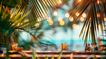 Blurred background blurred beach bar framed by palm leave