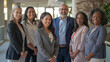 © Michael - Confident, diverse group of professionals smiling in a modern office setting