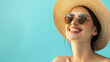 © Partha - woman wearing a straw hat and sunglasses, posing against a pastel orance background banner with copy space